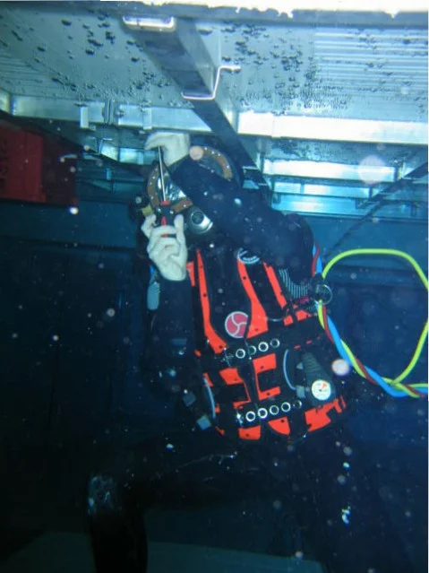 Diver working under moving floor